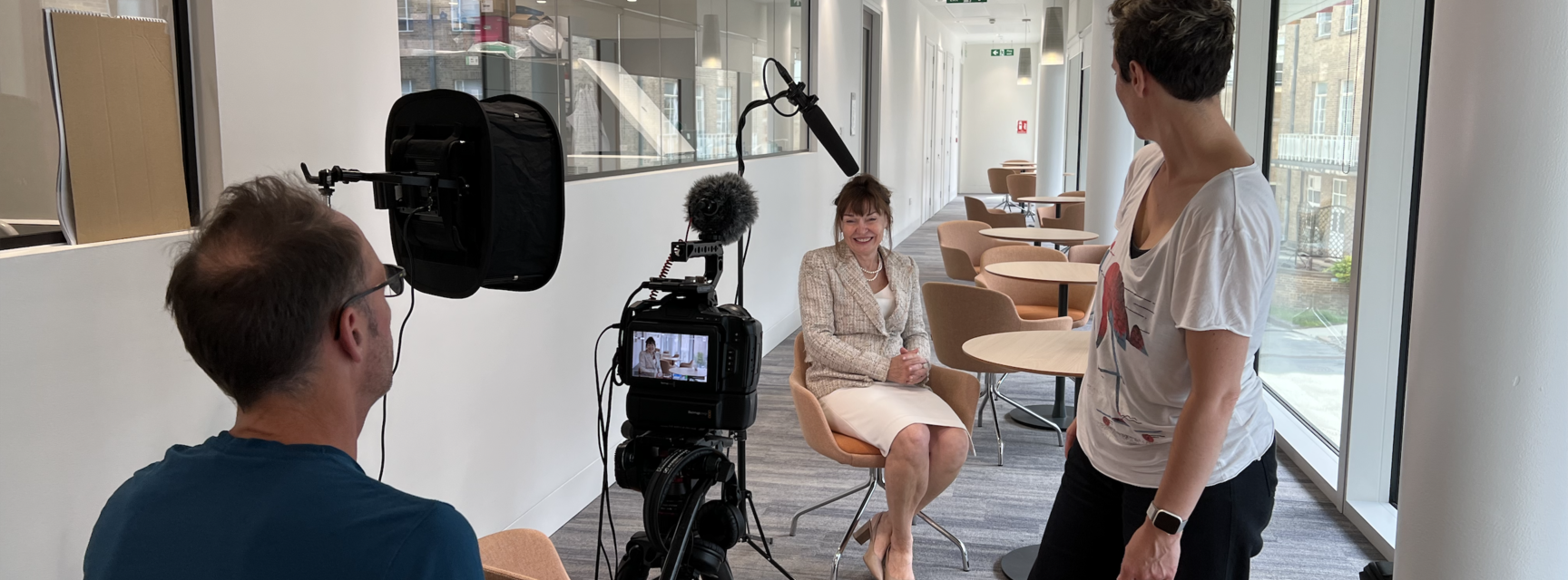 A photograph of Carol Robinson being interviewed.