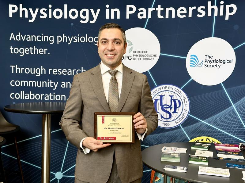 a photo of mootaz with the award