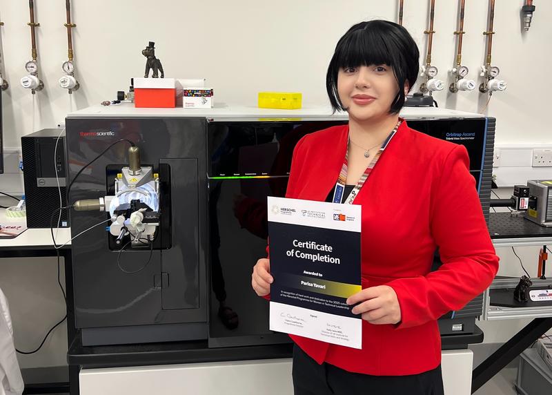 A photo of Parisa Yavari with her certificate of completion