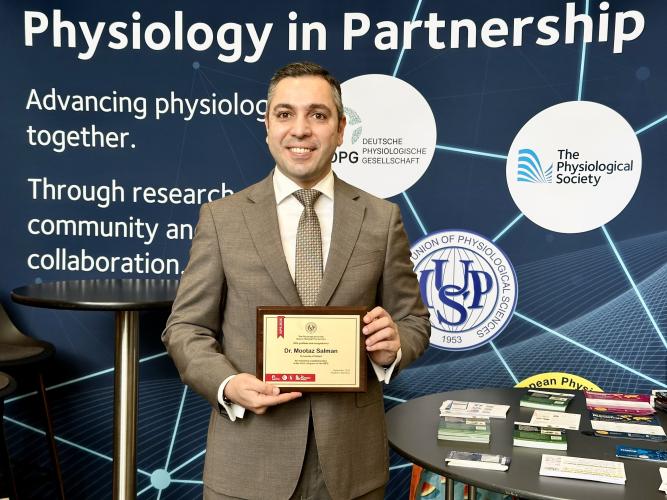 a photo of mootaz with the award