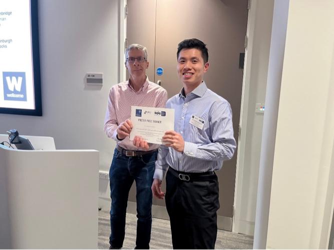 Dr Kevin McFarthing, Research Advisor, Parkinson's UK Oxford Branch, presenting a certificate to Victor (Shijun) Yan, from the Molecular Neurodegeneration Research Group, University of Oxford.