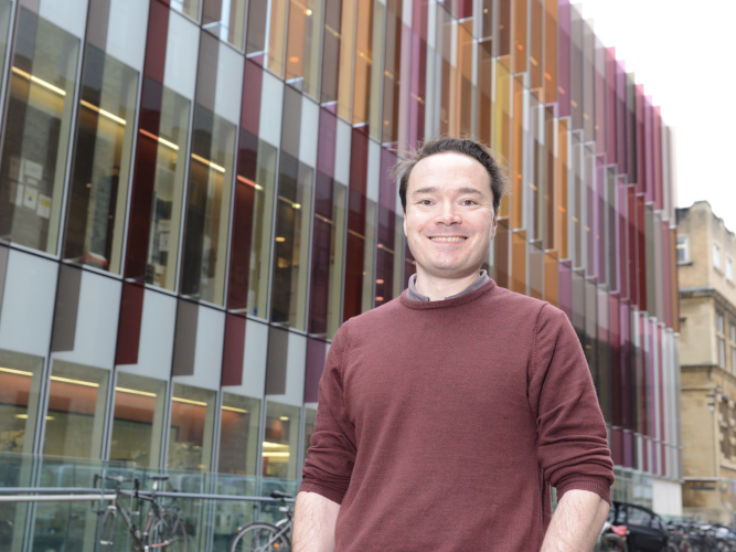 A photo of Simon Newstead in front of the DCH Building