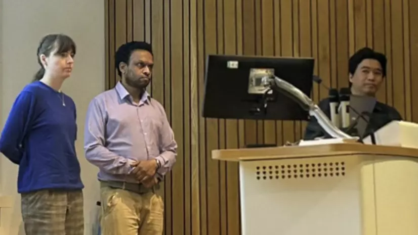 a photo of zitzmann lab presenting.