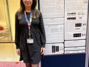 A photograph of Gizem Önal with her poster.
