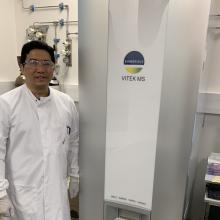 lead author and dphil student yohan arman next to the biomerieux vitek ms used in this study
